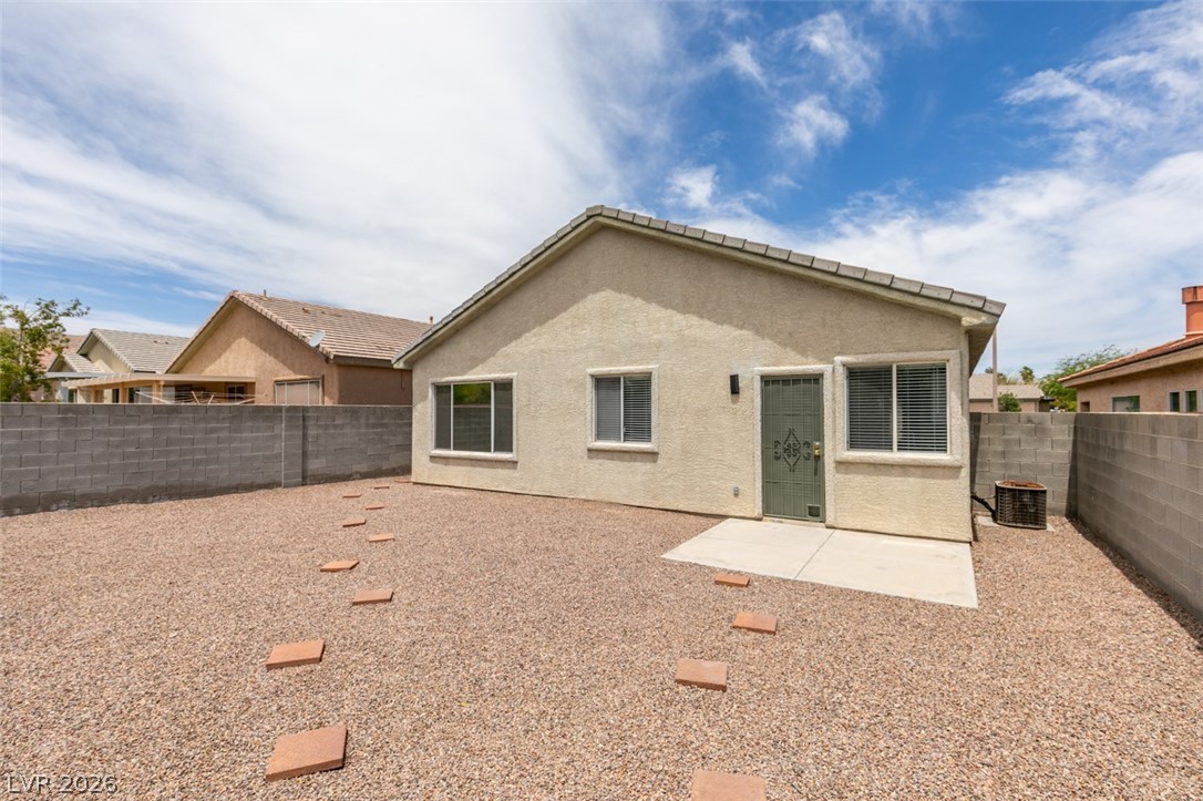 10959 Pumpkin Ridge Avenue Las Vegas, NV 89135 - Photo 32 of 51 A private backyard oasis with low-maintenance gravel landscaping and a stepping stone path.