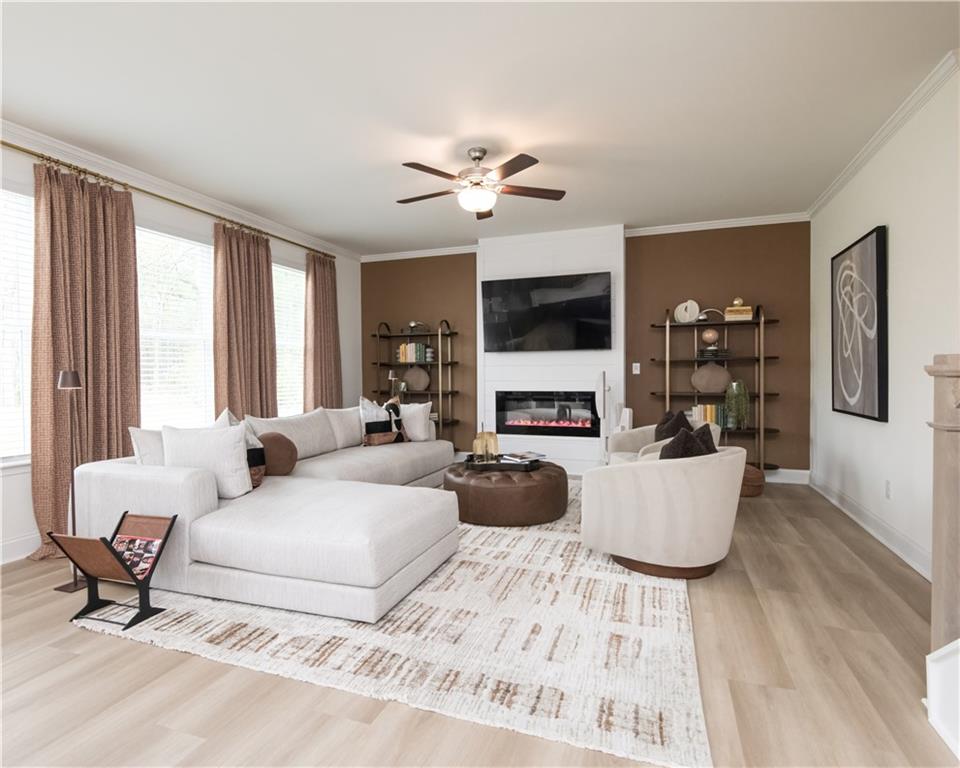 5910 Springs Way Stonecrest, GA 30038 - Photo 11 of 35 a living room with furniture a fireplace and a large window