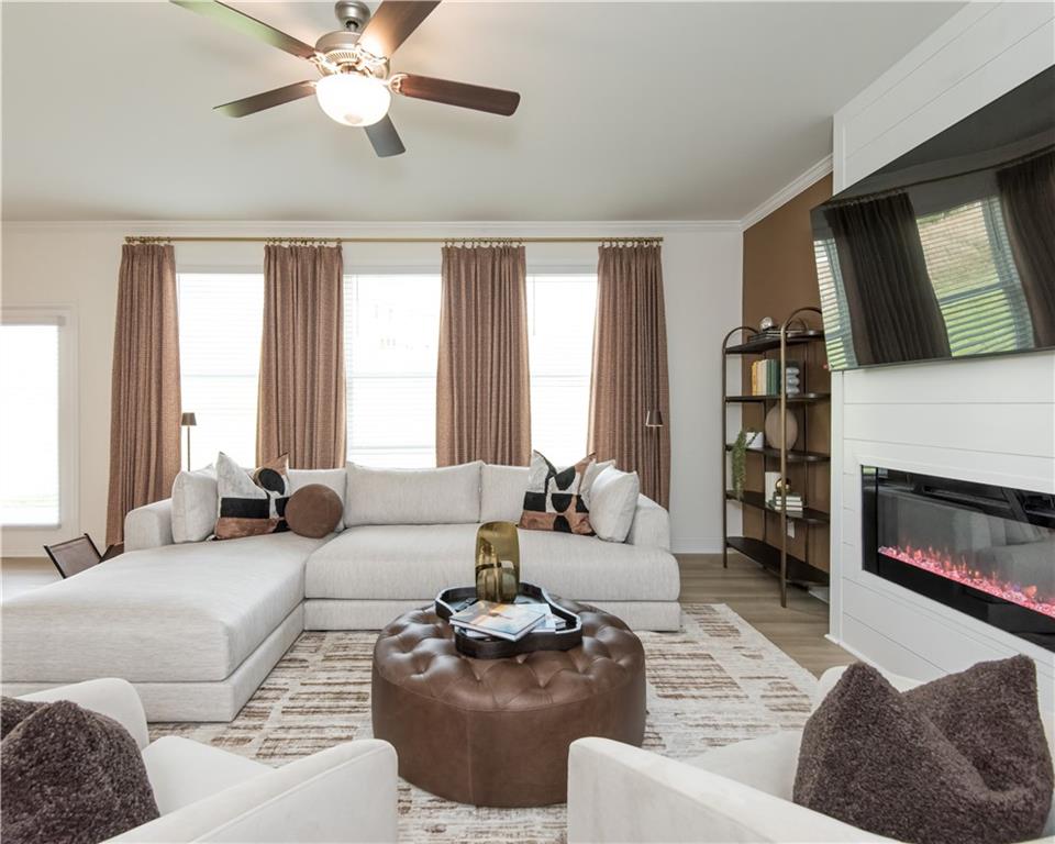 5910 Springs Way Stonecrest, GA 30038 - Photo 12 of 35 a living room with furniture fireplace and a large window