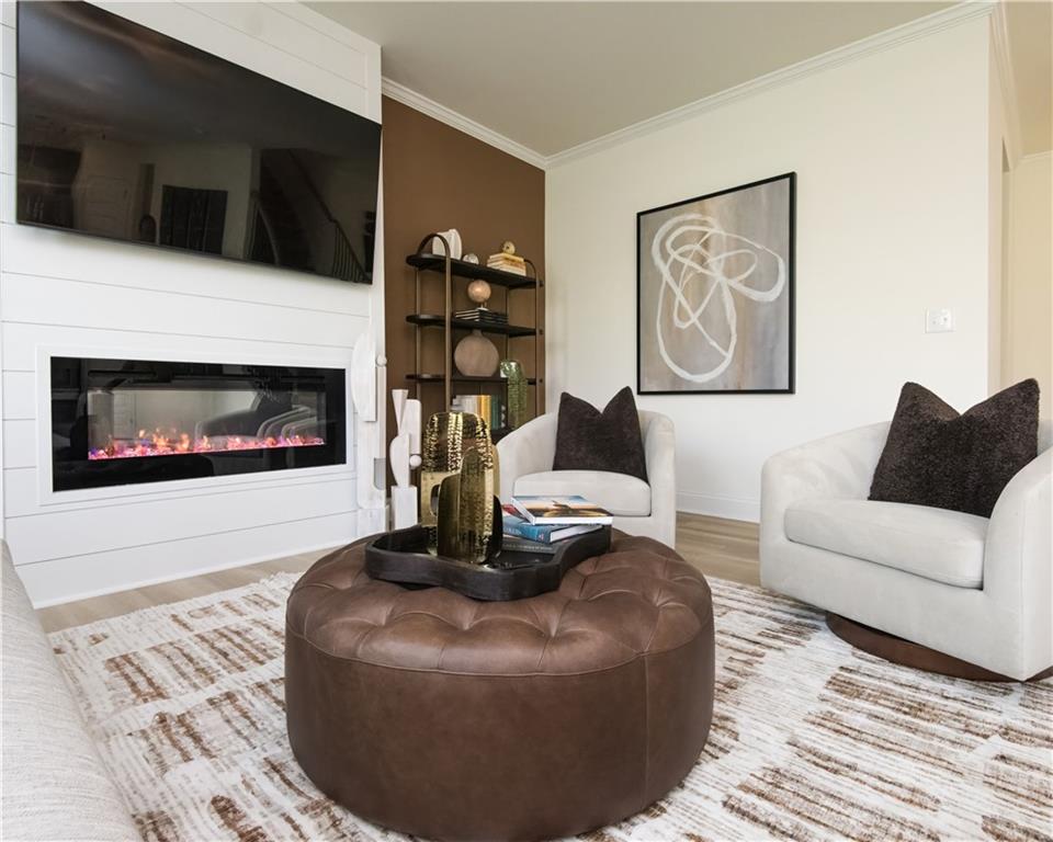 5910 Springs Way Stonecrest, GA 30038 - Photo 15 of 35 a living room with furniture and a fireplace