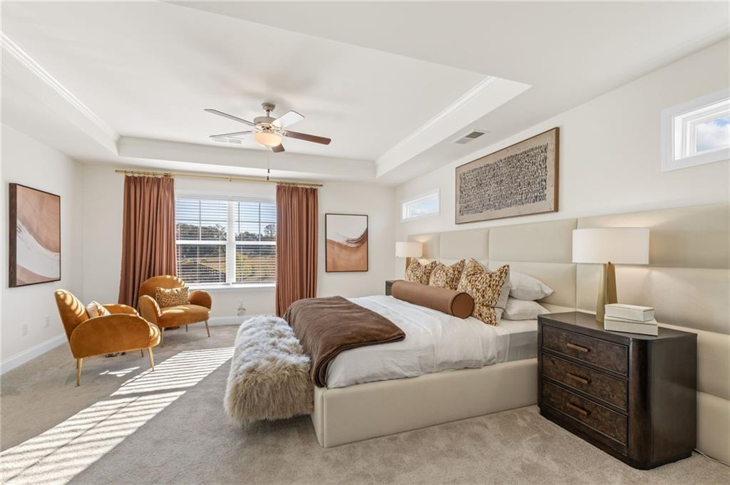 5910 Springs Way Stonecrest, GA 30038 - Photo 24 of 35 a spacious bedroom with a bed and glass window
