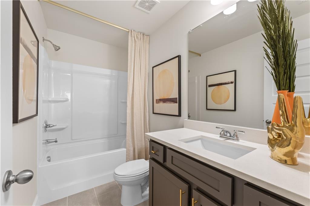 5910 Springs Way Stonecrest, GA 30038 - Photo 34 of 35 a bathroom with a sink a toilet and shower