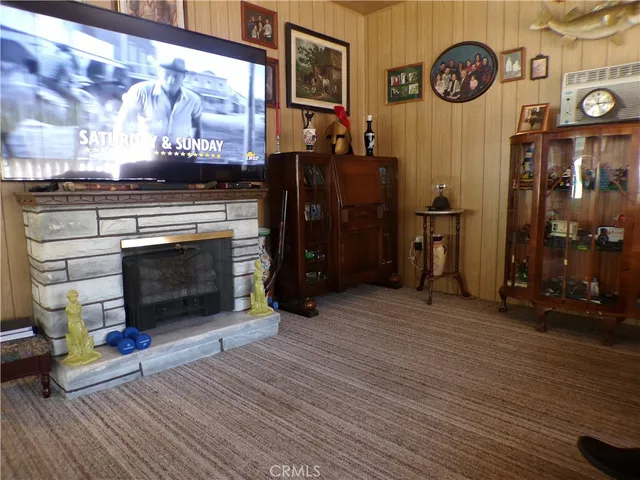 a view of a fireplace with wooden floor