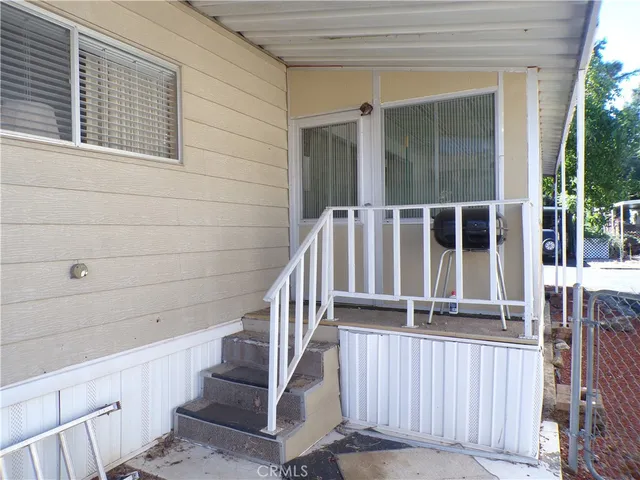 a view of staircase with white walls and windows
