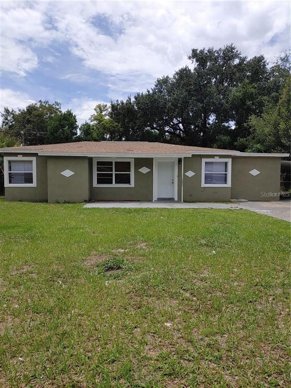 1014 San Domingo Road Orlando, FL 32808 - Photo 1 of 1 a view of a house with a yard