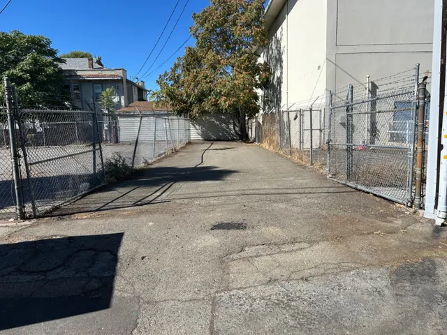 a view of a street with a building in the background