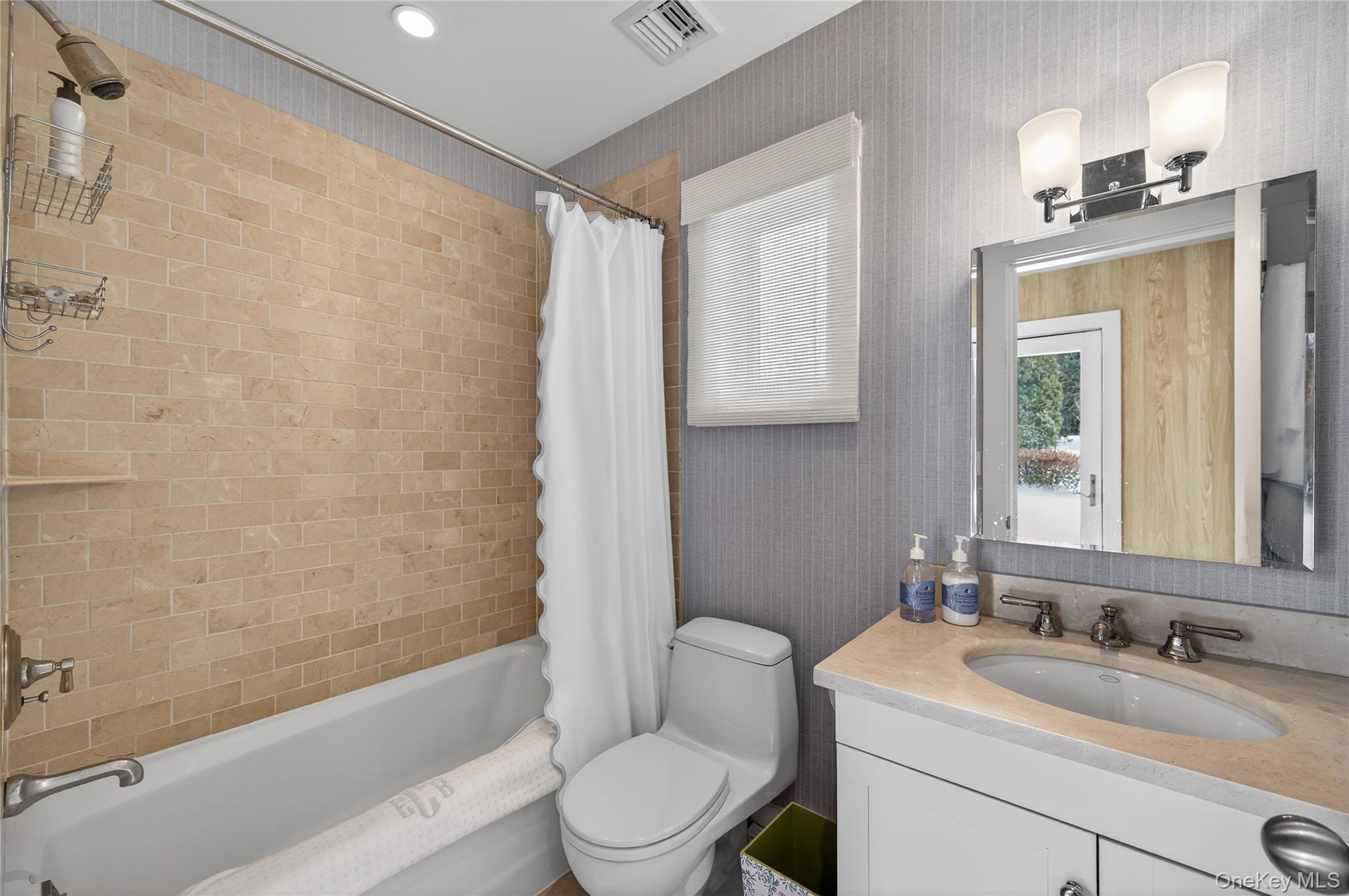 343 Chicken Valley Road Glen Head, NY 11545 - Photo 39 of 49 a bathroom with a granite countertop sink toilet a mirror and shower