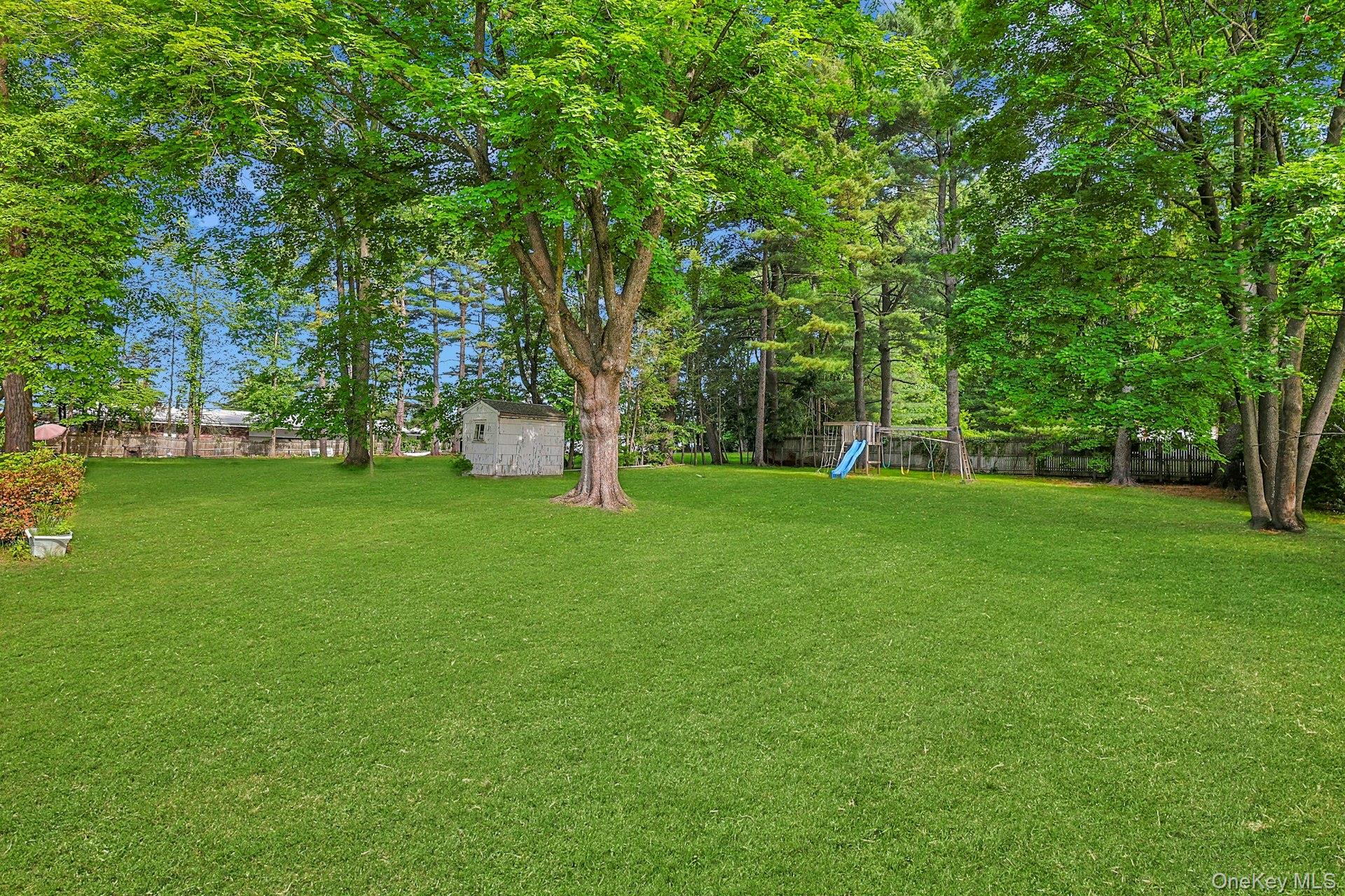 31 Townline Road Pearl River, NY 10965 - Photo 25 of 27 a view of green field with trees in the background