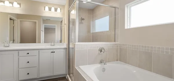 a bathroom with a bathtub and a sink