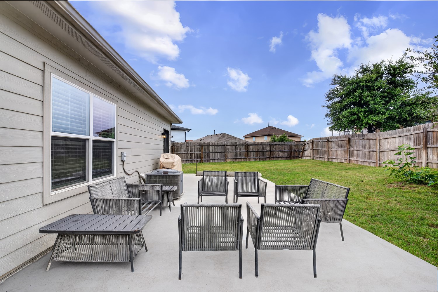 2006 Grow Lane Austin, TX 78754 - Photo 26 of 40 A spacious backyard patio provides an ideal setting for outdoor entertaining and relaxation.