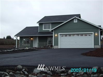 148 Fuller Road Chehalis, WA 98532 - Photo 1 of 1 a front view of a house with a garden