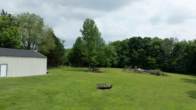 a backyard of a house with lots of green space