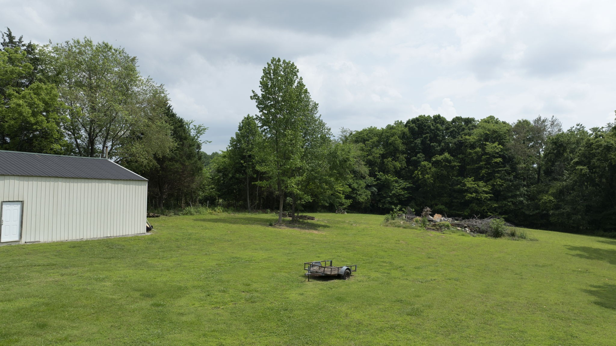 7855 Bethlehem Road Springfield, TN 37172 - Photo 13 of 25 a backyard of a house with lots of green space