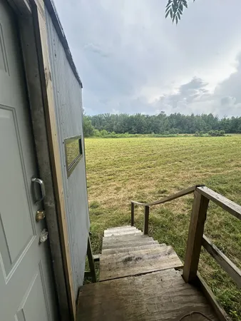 a view of wooden floor next to a lake