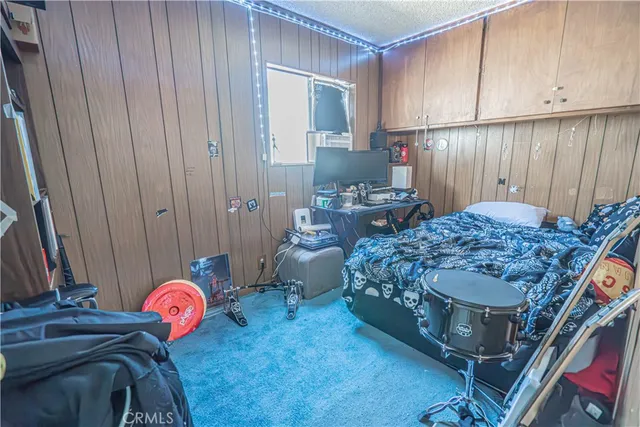 a bedroom with bed and a window