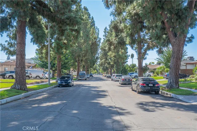 a view of a street with cars