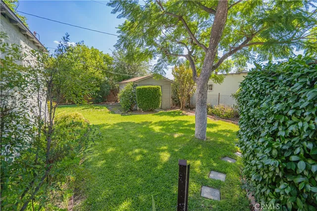 a view of a chairs and table in patio