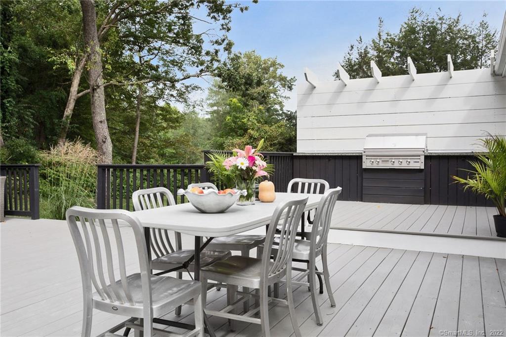 a view of a table and chairs on the roof deck