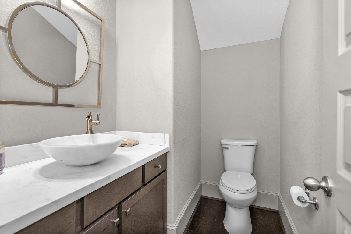 106 Cliftons Curve Way Montgomery, TX 77316 - Photo 24 of 47 Modern half-bathroom with a stylish vessel sink, & elegant custom mirror