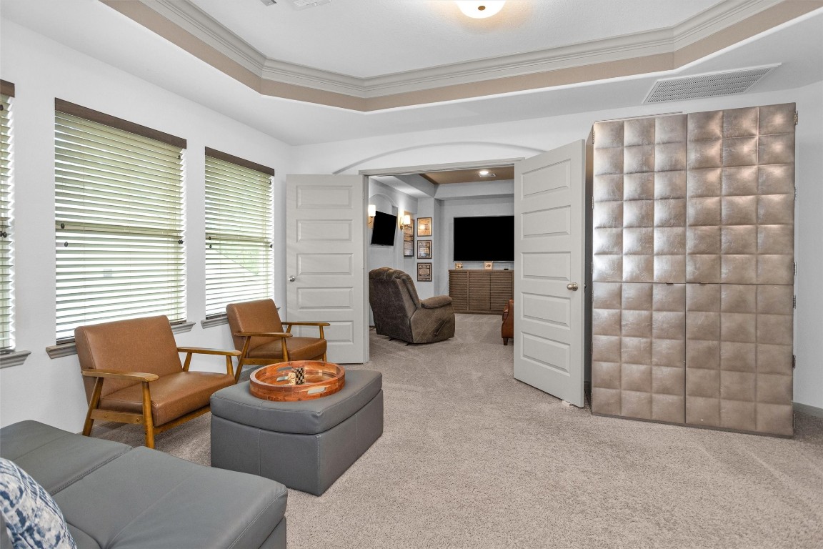 106 Cliftons Curve Way Montgomery, TX 77316 - Photo 31 of 47 Discover the perfect entertainment oasis with a stylish game room seamlessly leading into a cozy media room, ideal for relaxing and hosting movie nights.