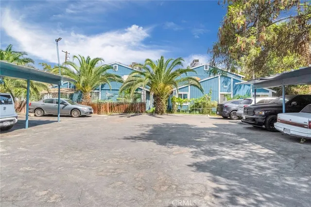 a view of a car park in front of a house