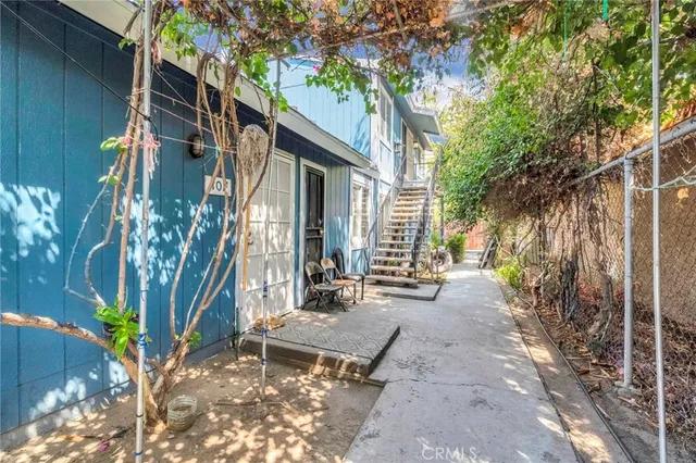 a living room with furniture a rug and a large window