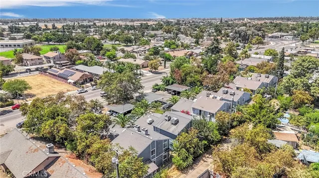 an aerial view of a house with a yard