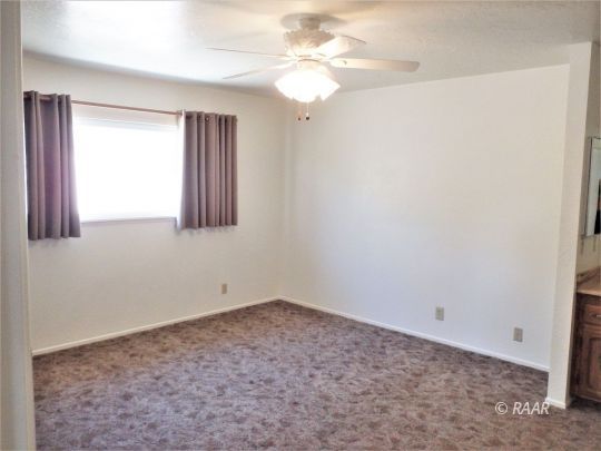 601 Weiman Avenue Ridgecrest, CA 93555 - Photo 24 of 35 a view of room with window and ceiling fan