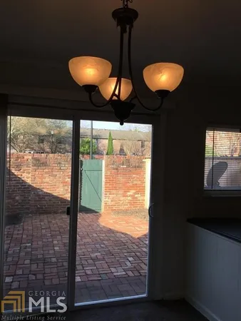 a view of a brick house with a street