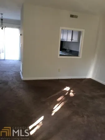 a view of an empty room and window