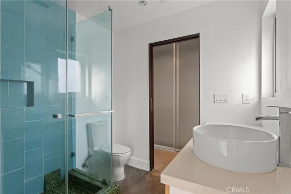 an empty room with large window and front door