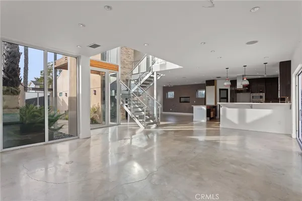 a view of a livingroom with stairs