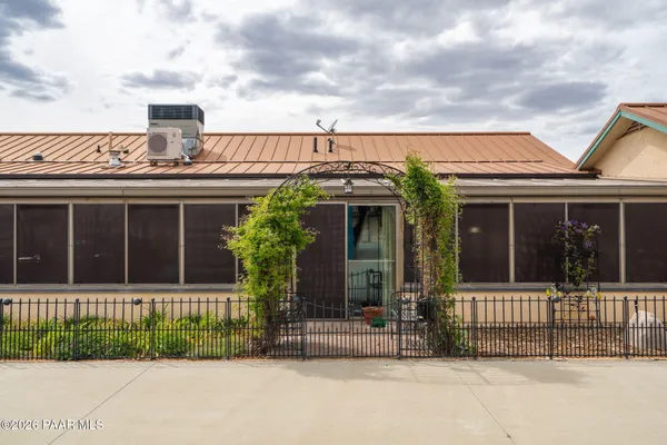 a kitchen with stainless steel appliances granite countertop a stove a sink dishwasher and a refrigerator