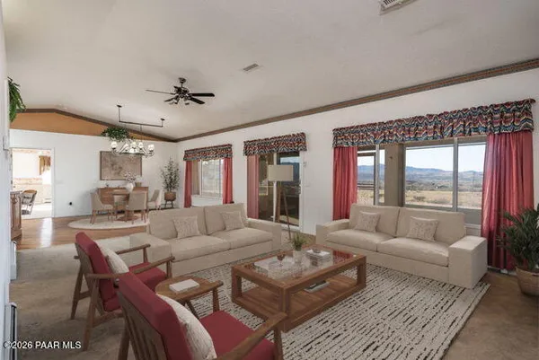 a kitchen with a refrigerator and white cabinets