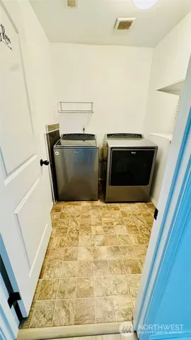 a bedroom with a bed and a rug