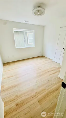 a view of an empty room with a window