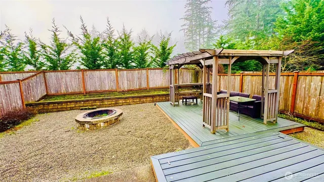 a view of a backyard with sitting area