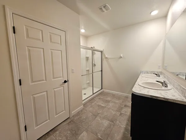 a bathroom with a sink a vanity and a mirror