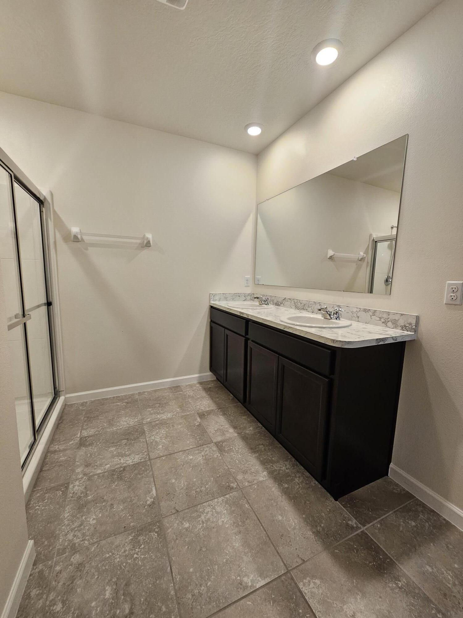 480 Sorrento Drive Cocoa, FL 32922 - Photo 18 of 24 a bathroom with a sink a vanity and a mirror