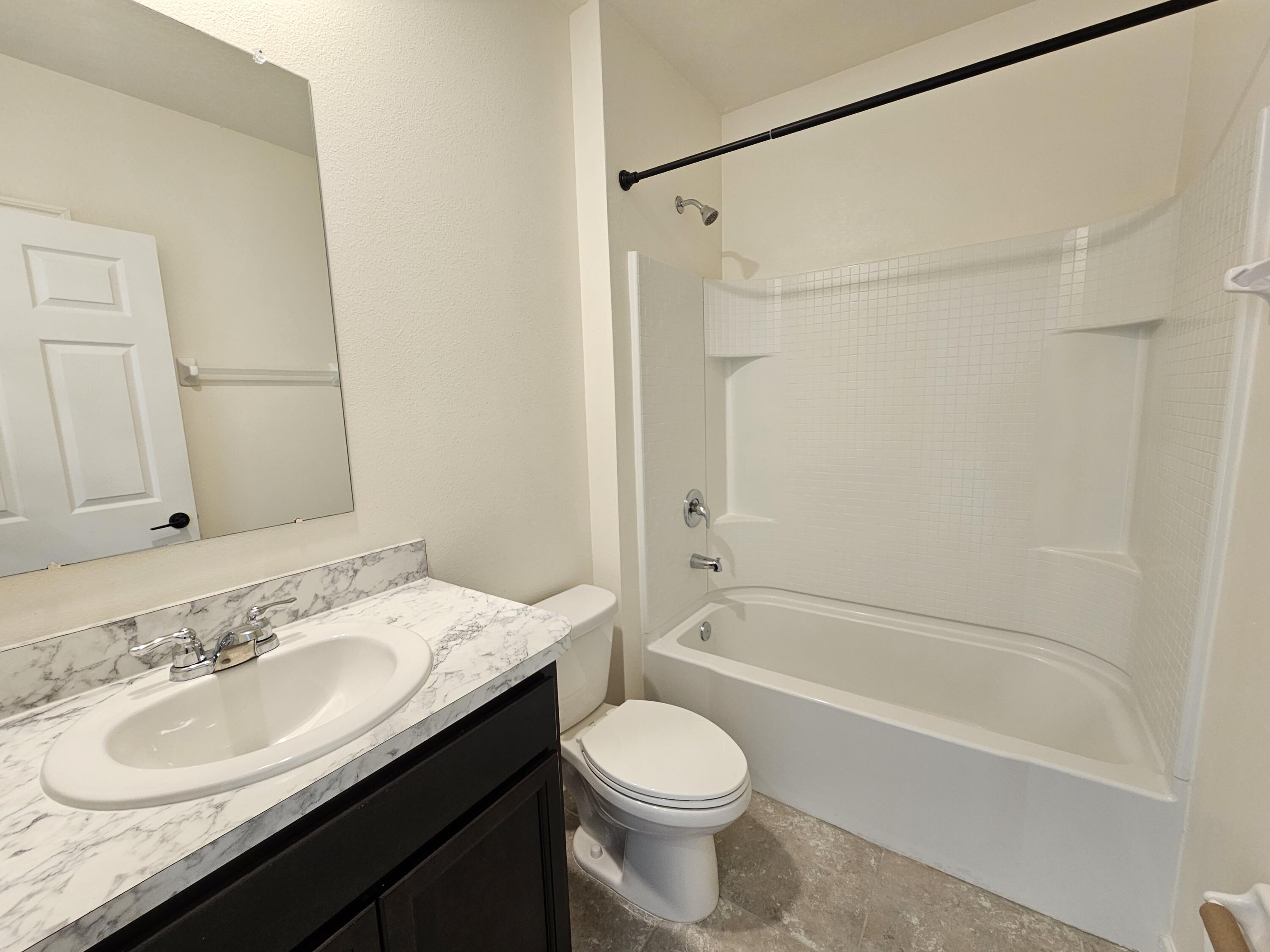 480 Sorrento Drive Cocoa, FL 32922 - Photo 20 of 24 a bathroom with a granite countertop sink toilet and shower