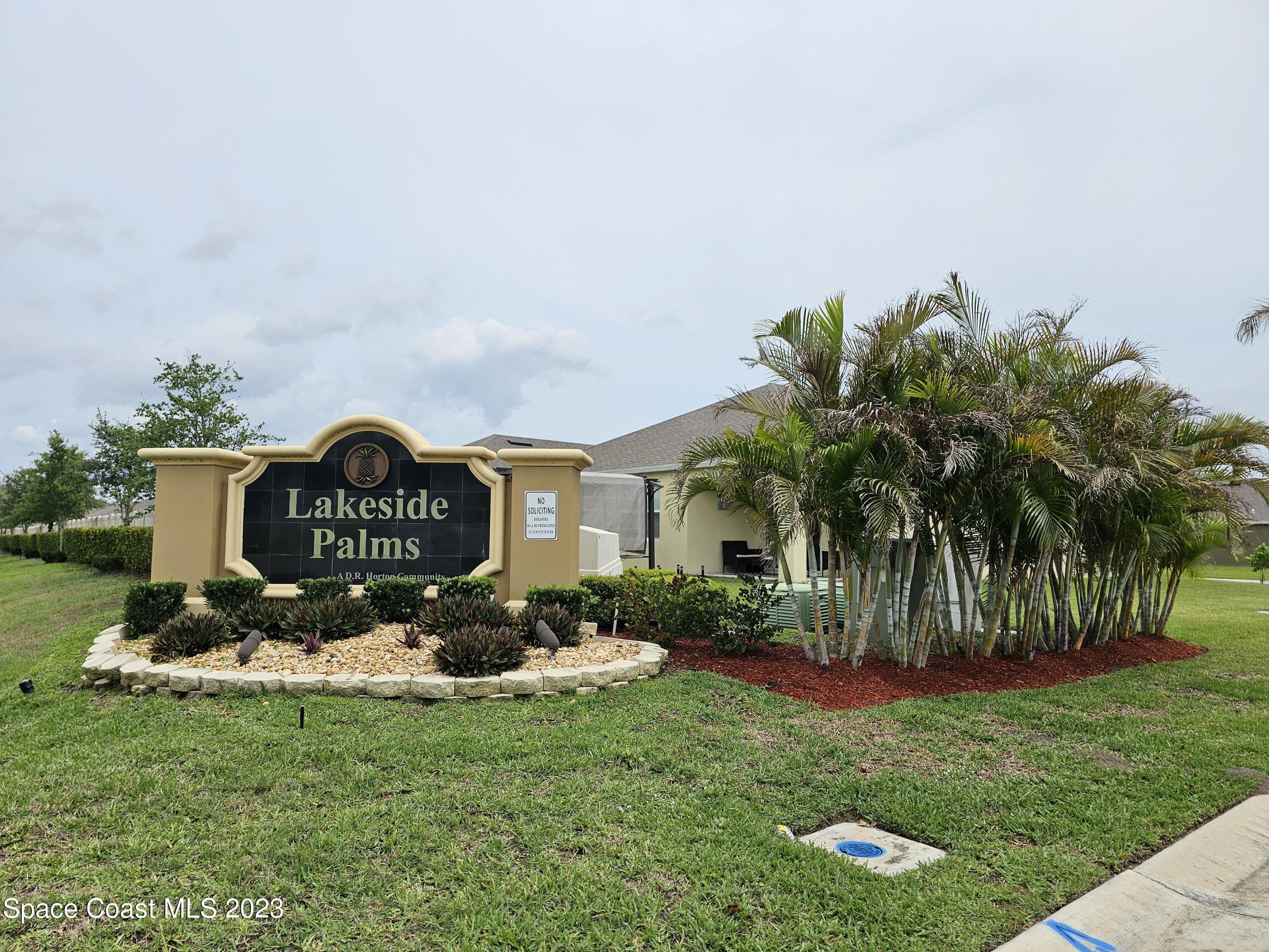 480 Sorrento Drive Cocoa, FL 32922 - Photo 24 of 24 a view of a sign in front of a house with a big yard