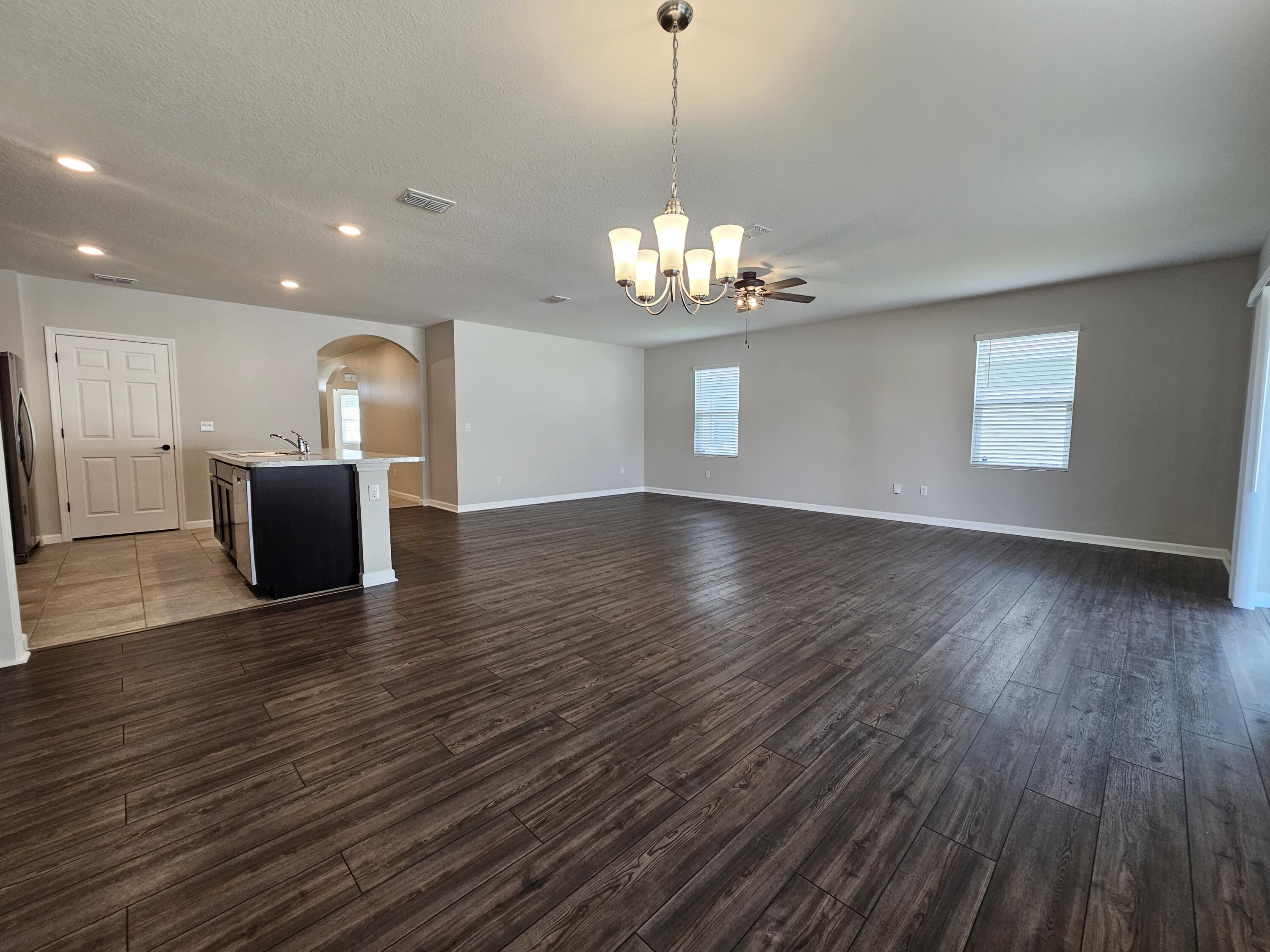 480 Sorrento Drive Cocoa, FL 32922 - Photo 9 of 24 a view of a livingroom with a kitchen and wooden floor