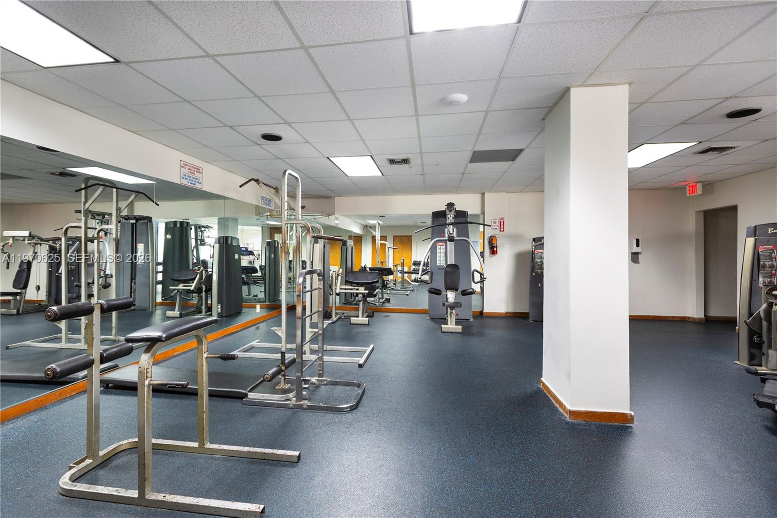191 Northwest 97th Avenue, Unit 421 Miami, FL 33174 - Photo 14 of 15 a view of a room with gym equipment