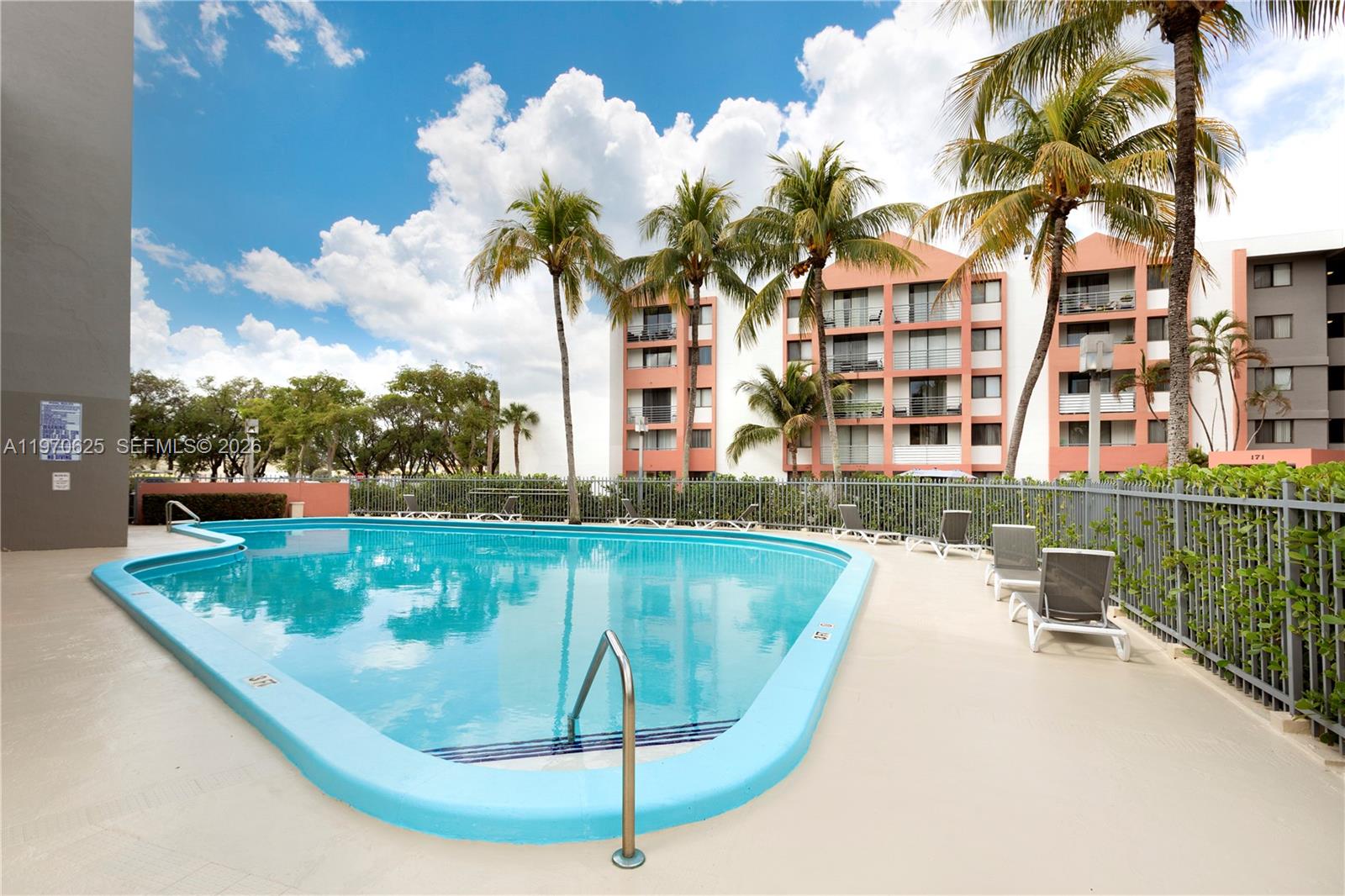 191 Northwest 97th Avenue, Unit 421 Miami, FL 33174 - Photo 15 of 15 a view of a swimming pool with a porch