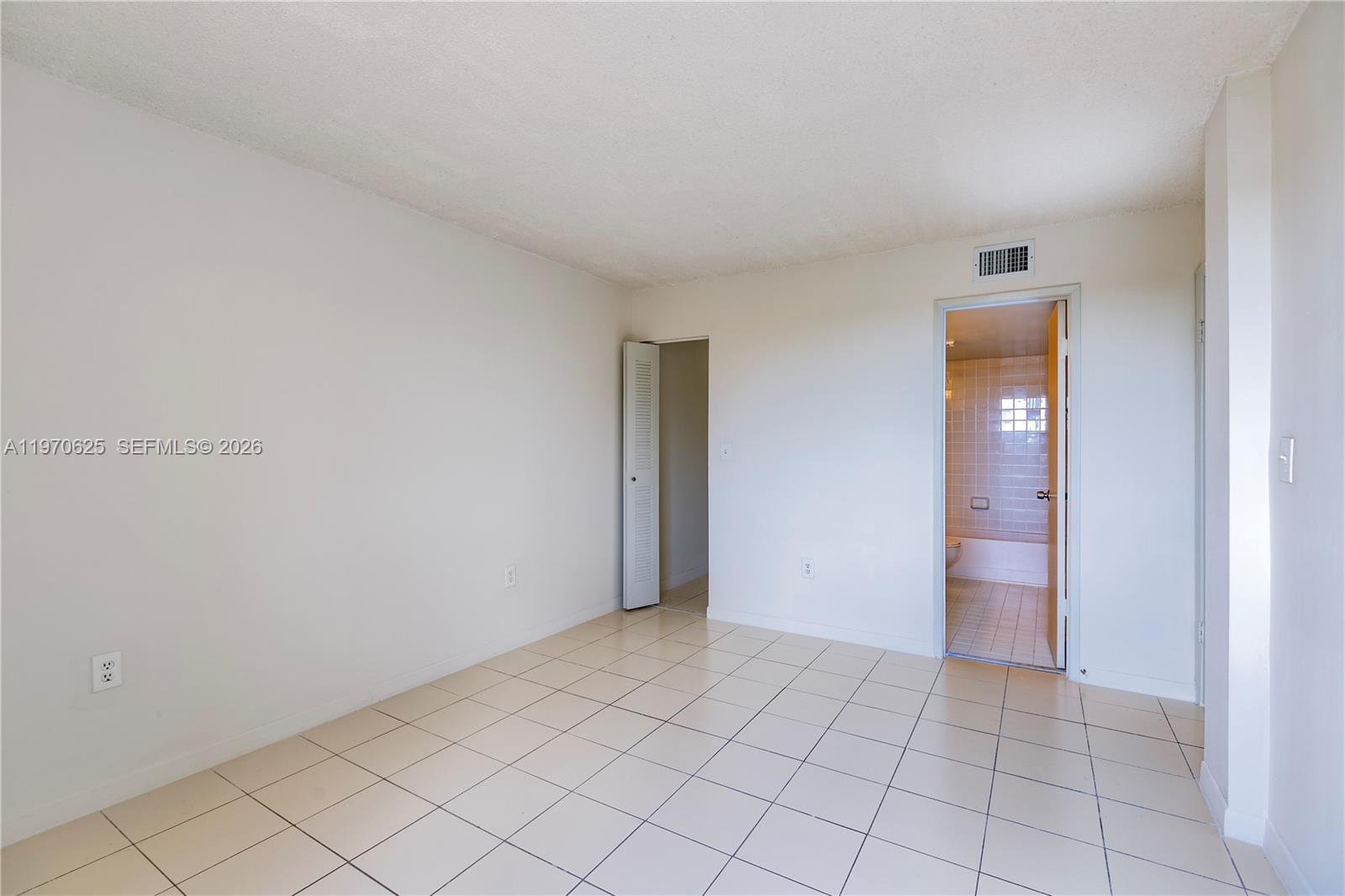 191 Northwest 97th Avenue, Unit 421 Miami, FL 33174 - Photo 7 of 15 a view of an empty room and window