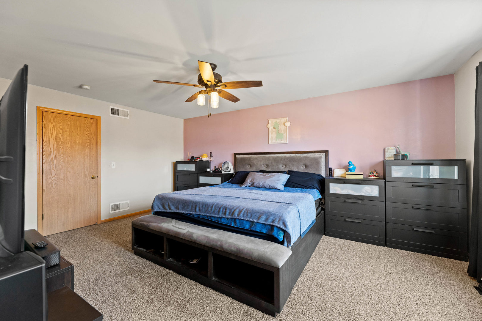 505 Frieh Drive Romeoville, IL 60446 - Photo 12 of 23 a bedroom with a bed and a chandelier