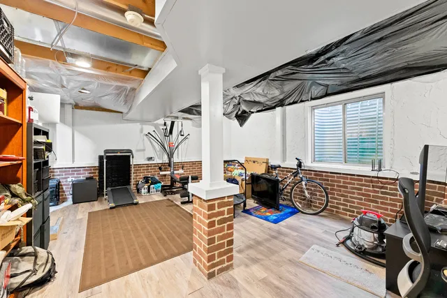 a bedroom with furniture and a fireplace
