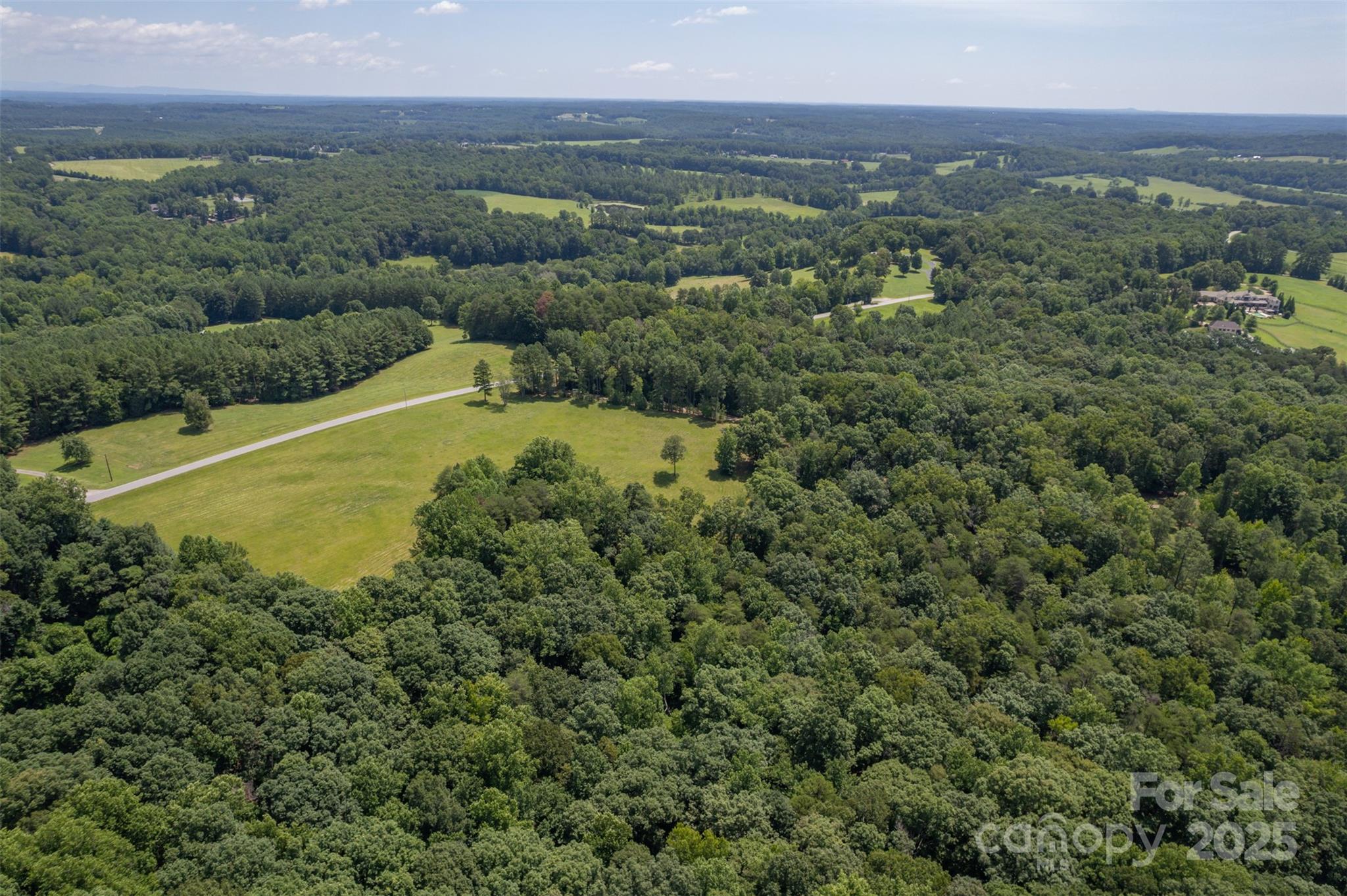 0 Jackson Grove Road Columbus, NC 28722 - Photo 19 of 28 a view of a city with lush green forest