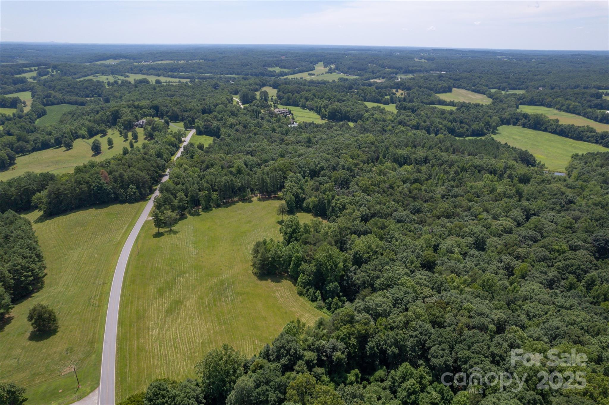 0 Jackson Grove Road Columbus, NC 28722 - Photo 20 of 28 an aerial view of a residential houses with outdoor space and trees all around