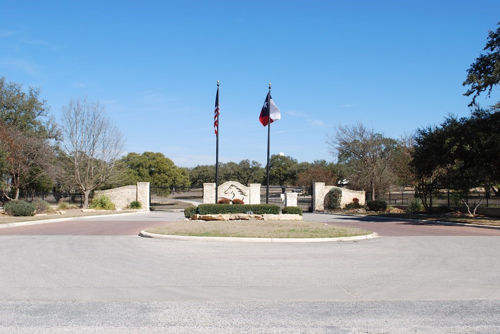 Tbd Lariat Trace Bandera, TX 78003 - Photo 6 of 6 a view of a street with a building in the background